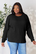 Trendsi black ribbed knit long sleeve sweater worn by plus size woman with round neckline