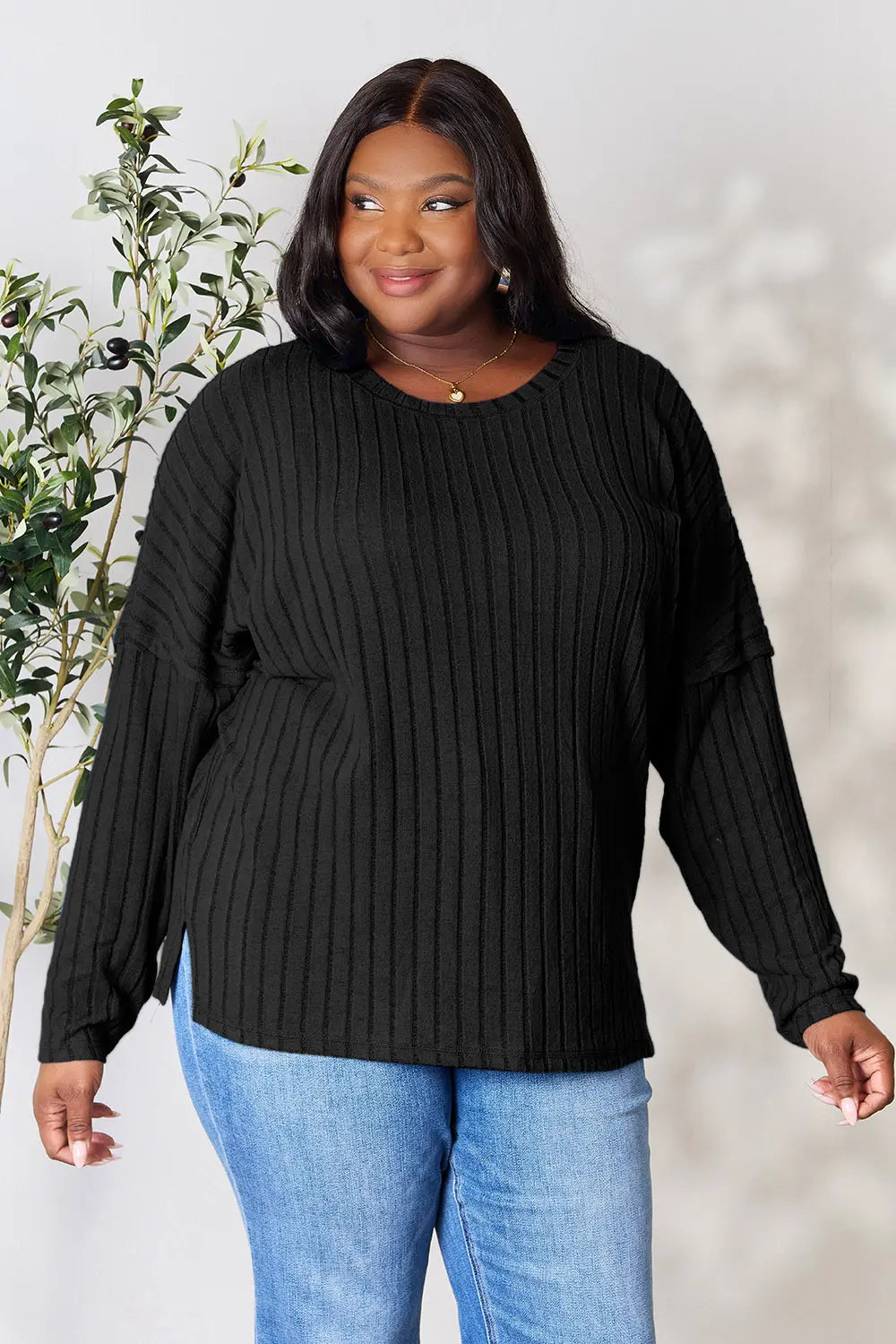 Trendsi black ribbed knit long sleeve sweater worn by plus size woman with round neckline