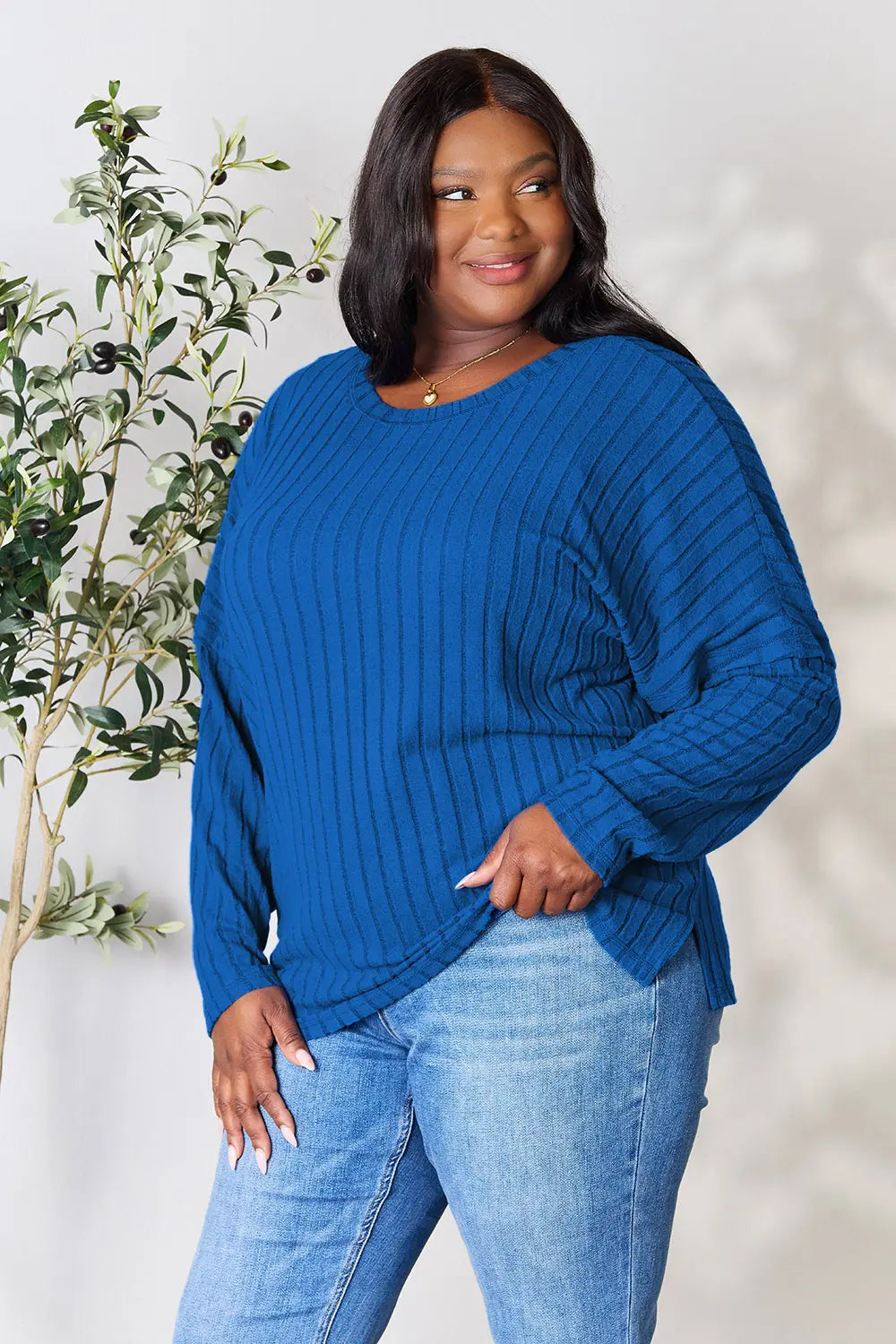 Trendsi blue ribbed knit long sleeve top worn by plus size model with jeans