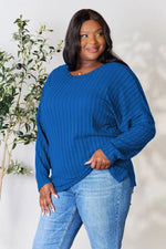 Trendsi blue ribbed knit long sleeve top worn by plus size model with jeans