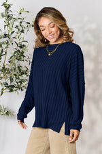 Trendsi navy blue ribbed knit long sleeve sweater with side slits worn by smiling woman
