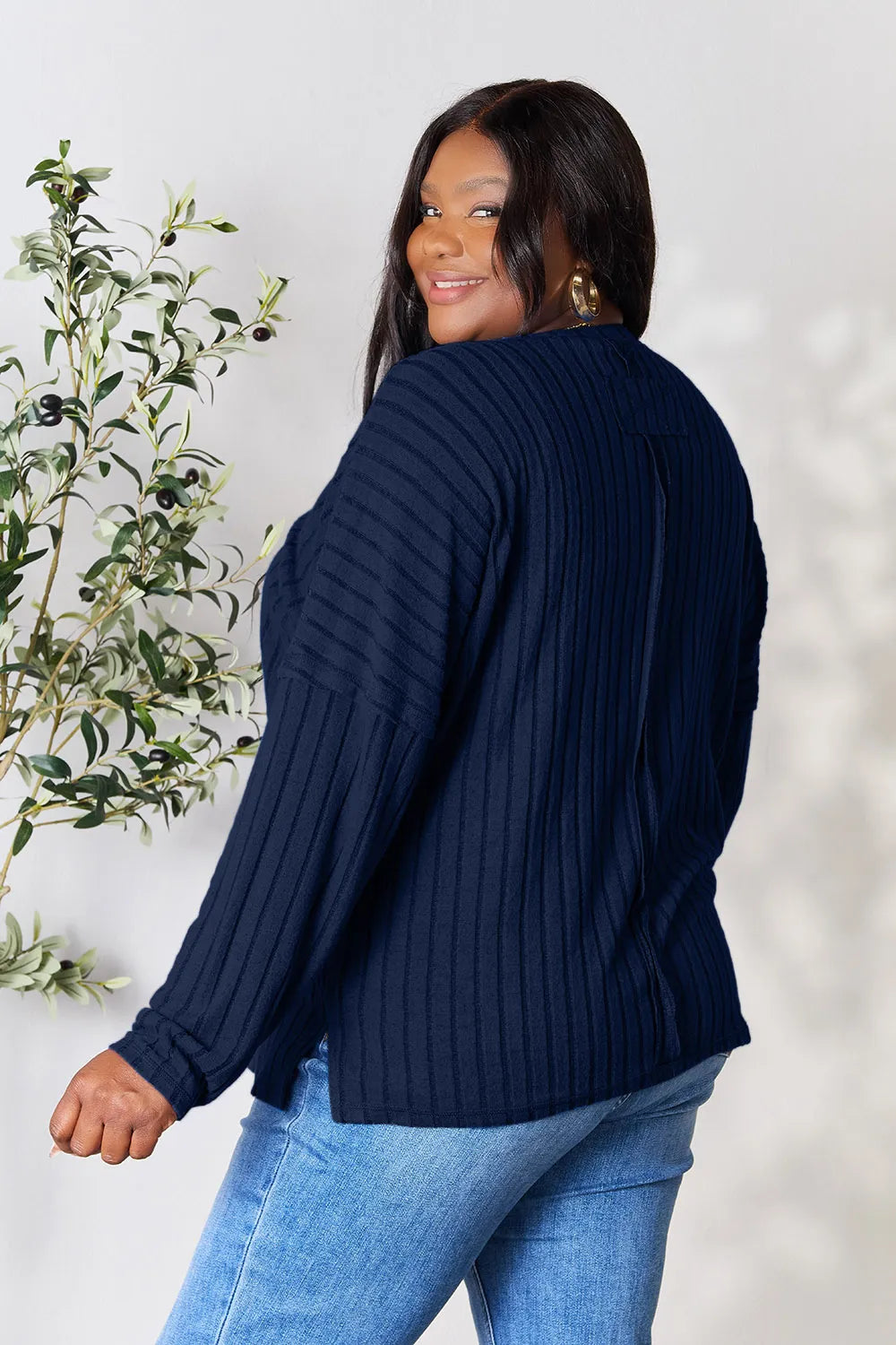 Trendsi navy blue ribbed knit long sleeve sweater worn by woman with gold earrings