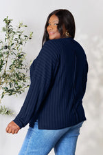 Trendsi navy blue ribbed knit long sleeve sweater worn by woman with gold earrings