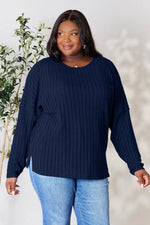 Trendsi navy blue ribbed knit long sleeve sweater worn by plus size woman with light blue jeans