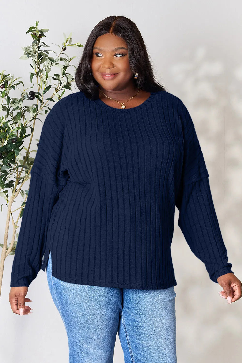 Trendsi navy blue ribbed knit long sleeve sweater worn by plus size woman with light blue jeans
