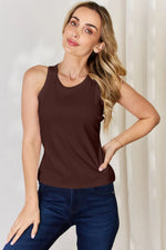 Trendsi brown top tank tops worn by woman paired with dark blue jeans in a casual pose